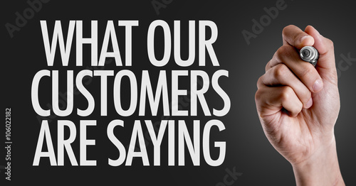 Hand writing the text: What Our Customers Are Saying photo