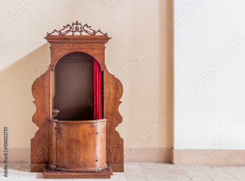 Old wooden confessional photo