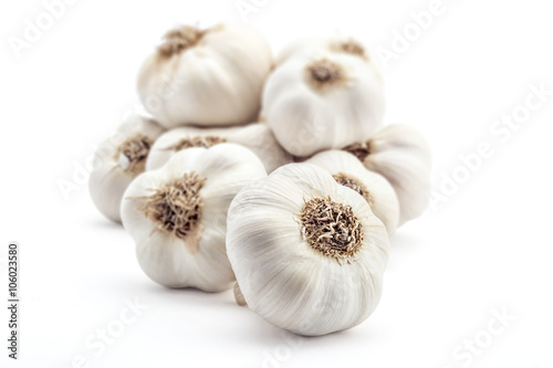 Pile of fresh organic garlic isolated on white background