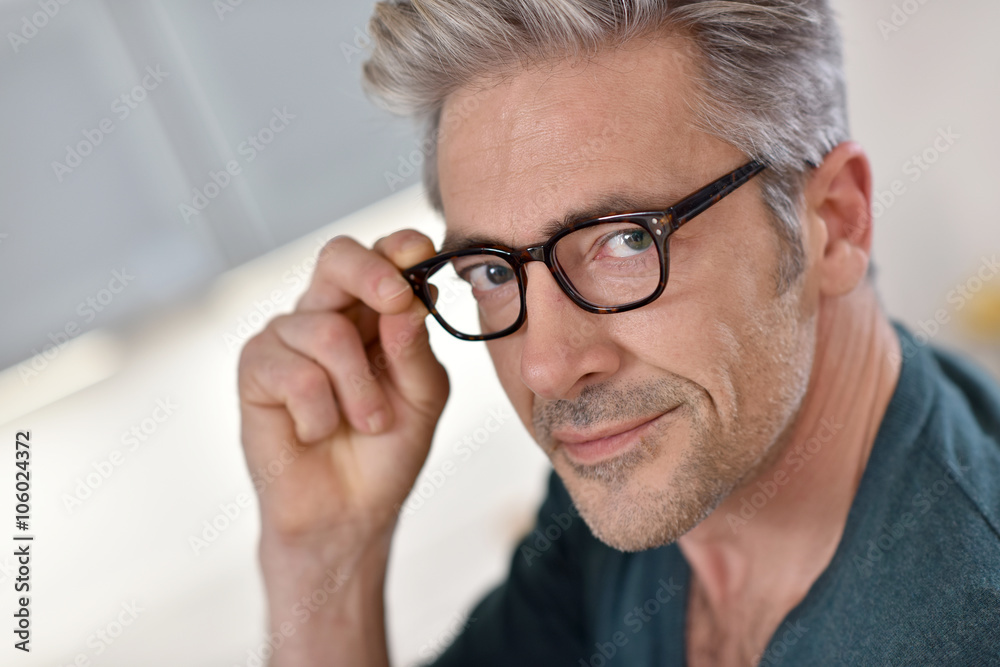 Portrait of handsome mature man with eyeglasses