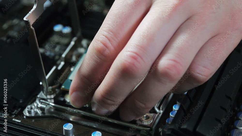 cpu in hand and motherboard for a home computer. dolly shot cpu in hand and motherboard for a home computer. dolly shot