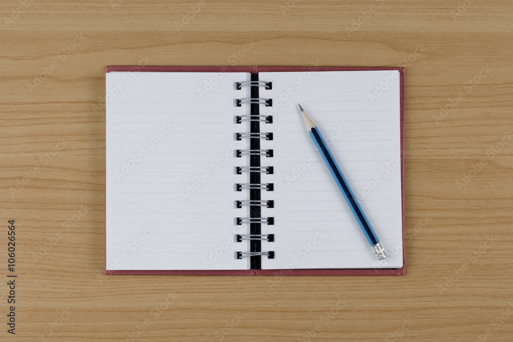 Blank notebook and pencil on wood table. Blank notebook and pencil on wood table.