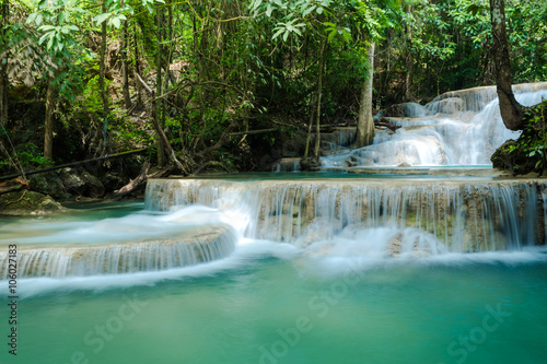 Green landscape with cgreen waterfall