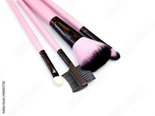 Fototapeta Naklejka Na Ścianę i Meble -  Some different kind of make-up brushes isolated on white