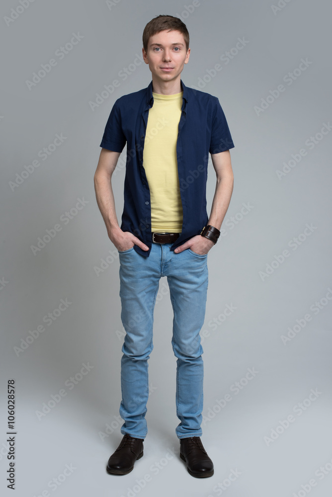 handsome man standing over gray background handsome man standing over gray background