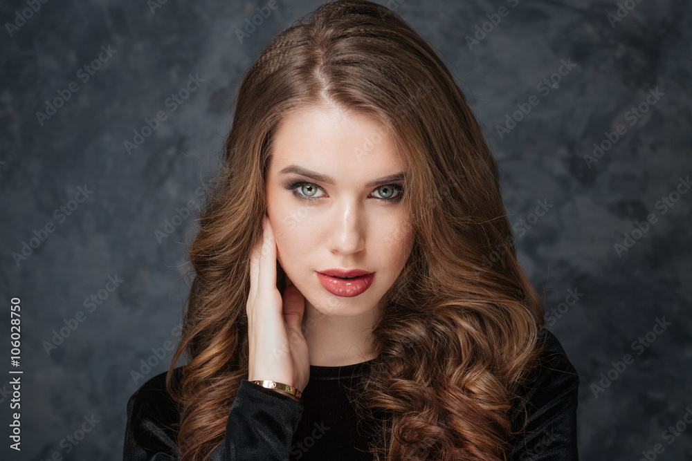 Fototapeta premium Attractive young woman looking at camera