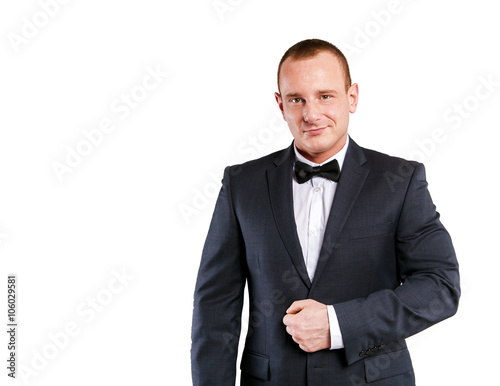 Businessman isolated over white background, smiling.