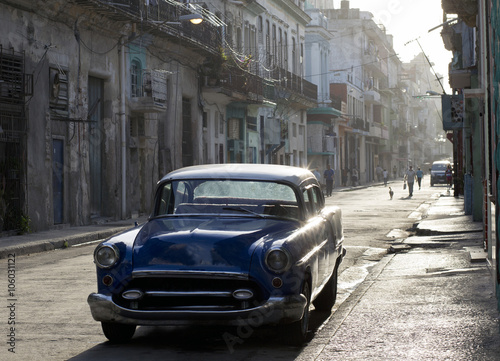 A classic blue car in the street of Havana