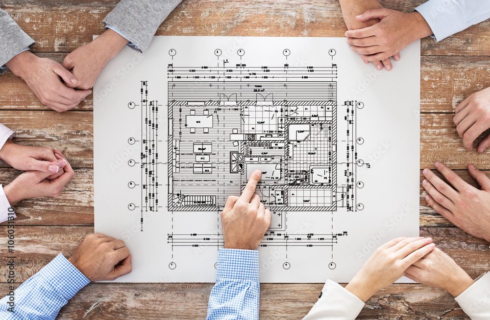 Obraz premium close up of business group with blueprint
