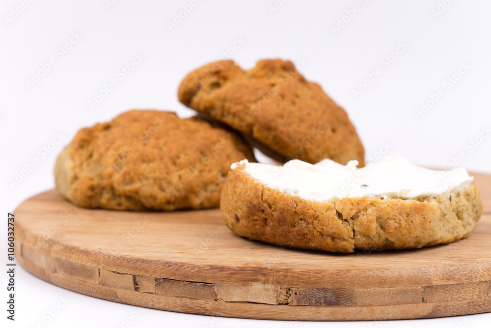 Breakfast bread with cream on the kitchen board Breakfast bread with cream on the kitchen board