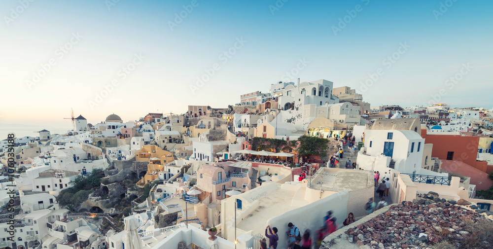 OIA, GREECE - MAY 12, 2014: Tourists await the famous sunset in