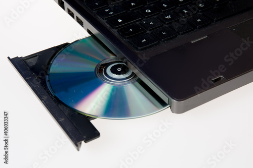 Close up image of a computer and cd and dvd