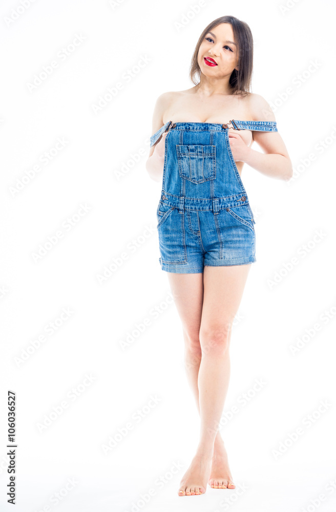 Nude woman denim overalls Stock Photo | Adobe Stock