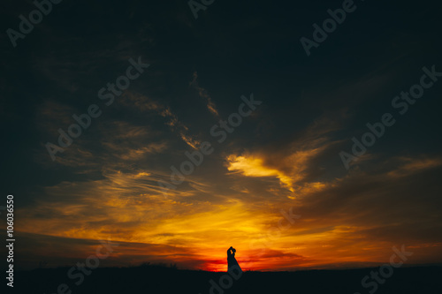 wedding couple on the background of sunset