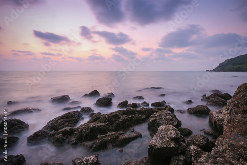 Coastal twilight scene  Long Exposure of rocks and waves at suns