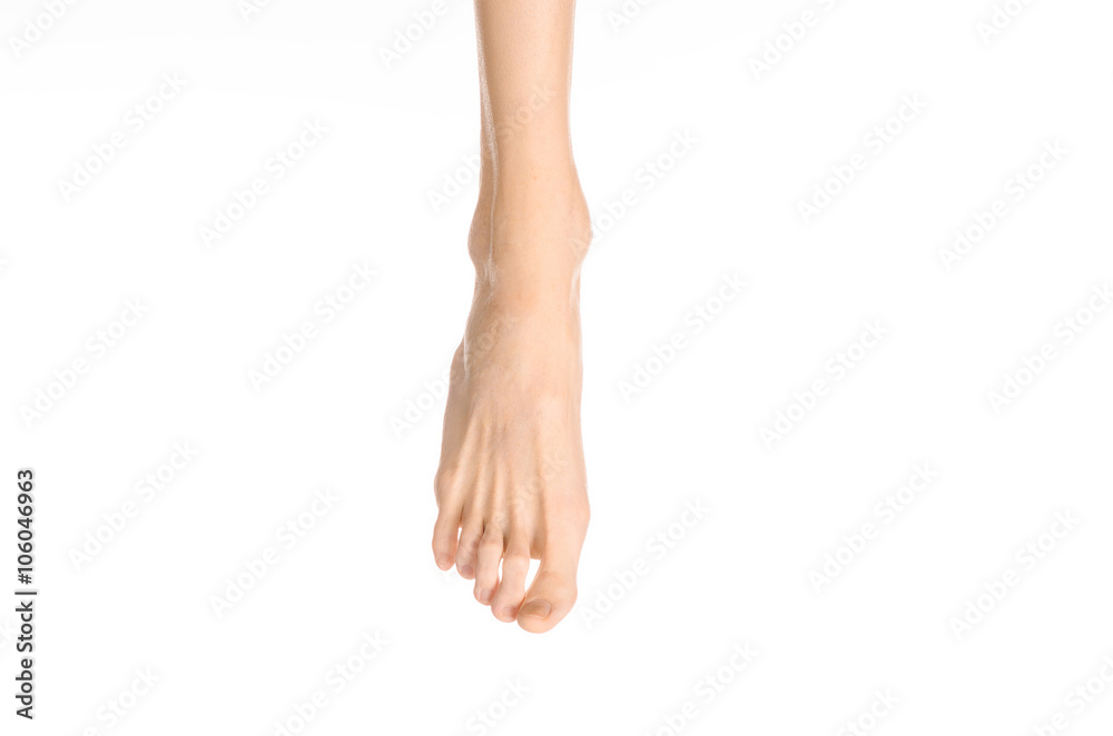 Pedicure and foot care topic: the naked man's legs isolated on white background in studio