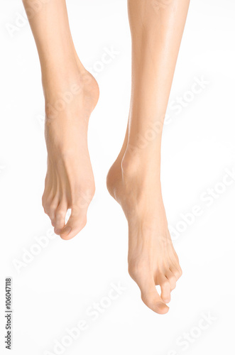 Pedicure and foot care topic: the naked man's legs isolated on white background in studio © Parad St