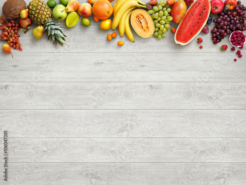 Fototapeta Naklejka Na Ścianę i Meble -  Healthy food background. Studio photo of different fruits on white wooden table. High resolution product.