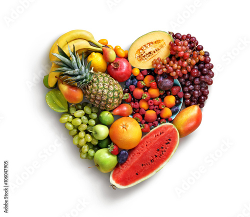 Fototapeta Naklejka Na Ścianę i Meble -  Heart symbol. Fruits diet concept. Food photography of heart made from different fruits isolated white background. High resolution product