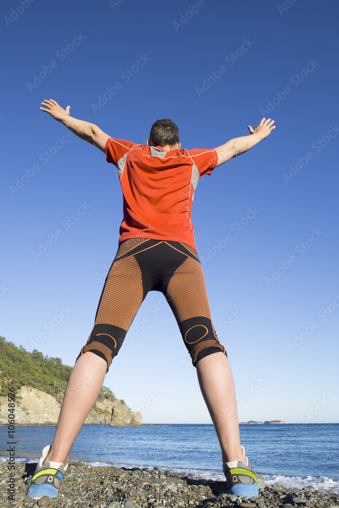 Fototapeta premium Trail running athlete man training for fitness and marathon living healthy lifestyle outside in beautiful landscape on Big Island.