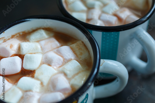Close-up shot of two mugs of hot cacao with marshmallow