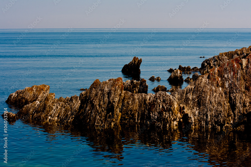 Rock formation sprouting from the sea. Rock formation sprouting from the sea.