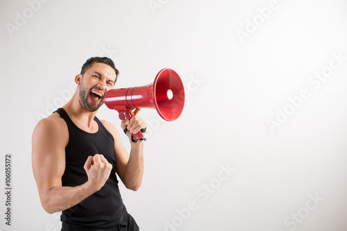 Male dancer shouts in a loudspeaker