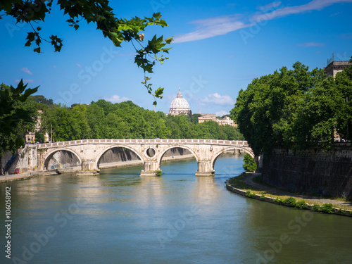 Tiber river in Rome with St Peter's cathedral in the background