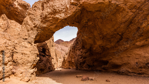Tall arch at Death Valley. Wind and water did the bridge between the rocks. Natural bridge canyon trail, Death Valley