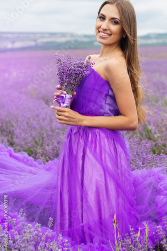 Fashion woman with bouquet of lavender flowers