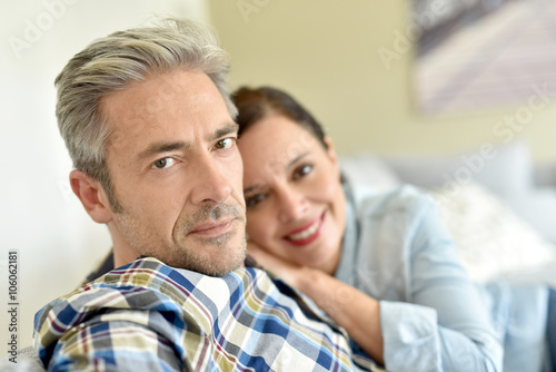 Middle-aged couple relaxing in sofa at thome © goodluz