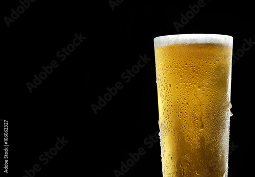 beer in a glass on a black background