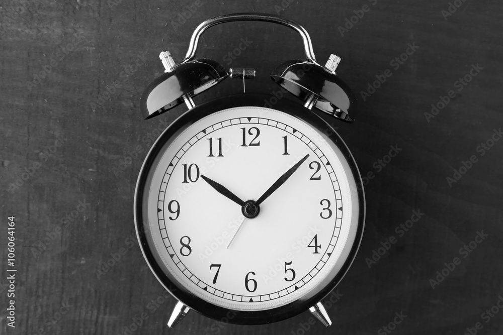 Alarm clock on old wooden table. Alarm clock on old wooden table.
