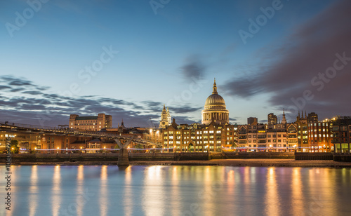 Canvas Print Millennium Bridge and St Pauls Cathedral at night in London.