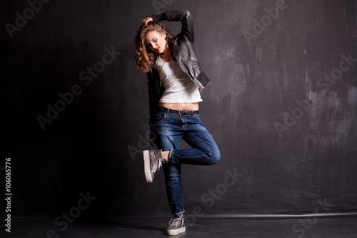 model girl dancing on a black background