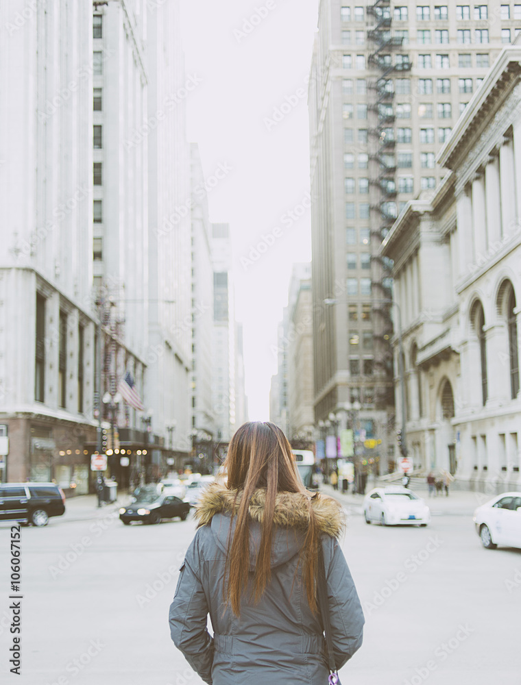 Fototapeta premium Beautiful woman on the background of city