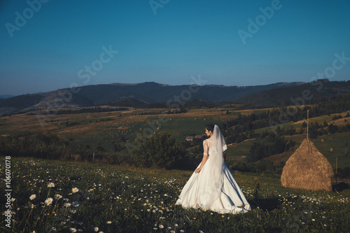 Beautiful bride outdoors in a forest.