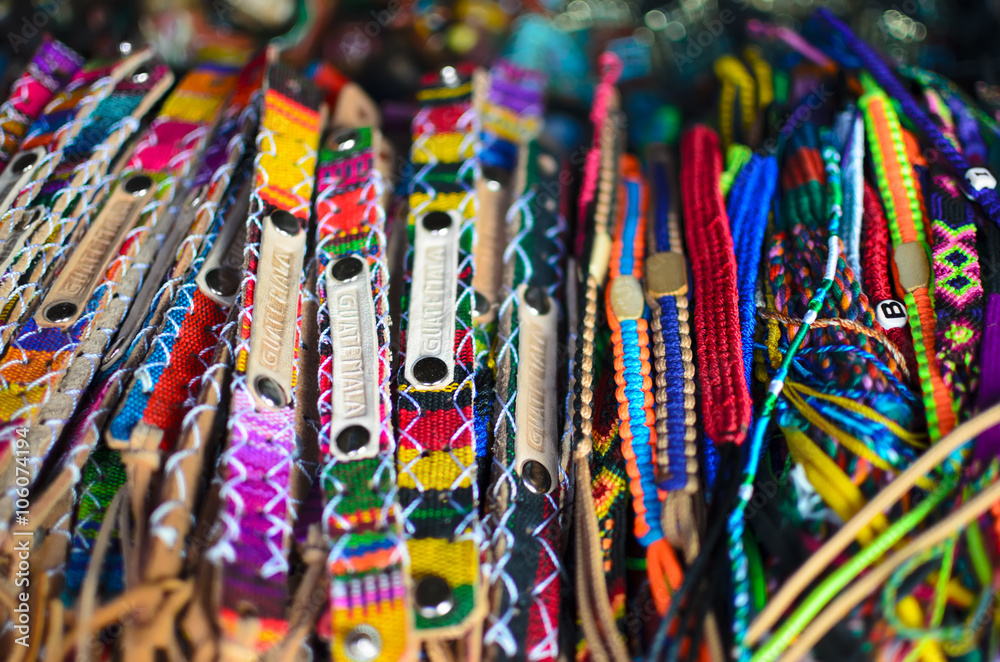 Fototapeta premium Numerous wristbands with Guatemala sing at the craft market 