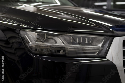 Modern car headlights. Exterior detail. © alexdemeshko