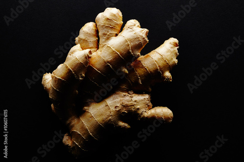 Ginger root. On black background.