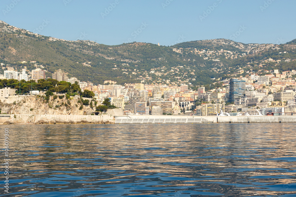 Color DSLR stock image of luxury apartment building and condominiums in Monte Carlo, Monaco, on the French Riviera. Horizontal with copy space for text