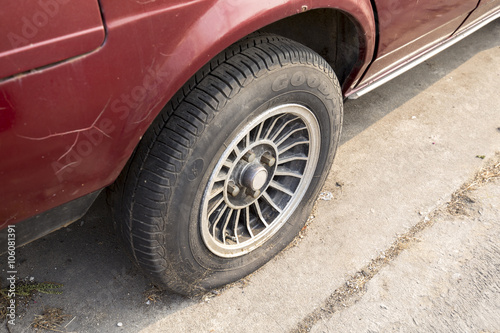 Car wheel flat tire on the road © oatharts