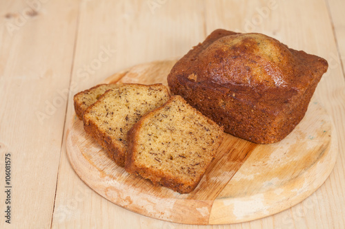 Homemade banana bread sliced on a table . rustic style