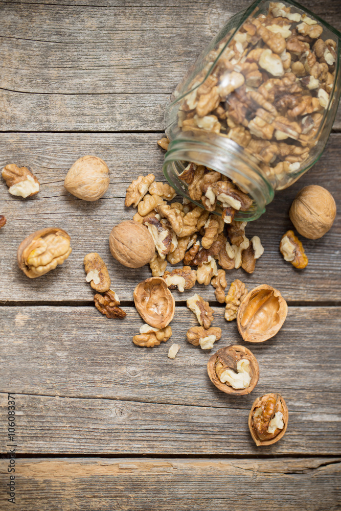 walnuts on rustic old wooden table walnuts on rustic old wooden table