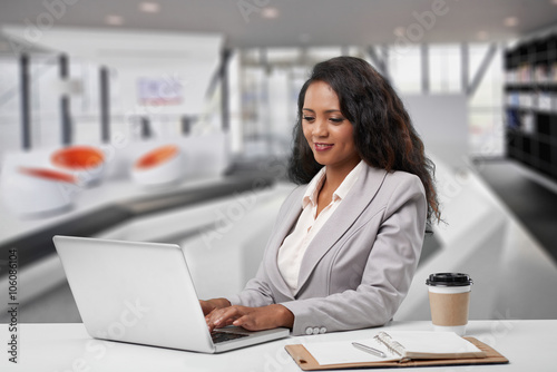 Young Malagasy business woman working on laptop in the office