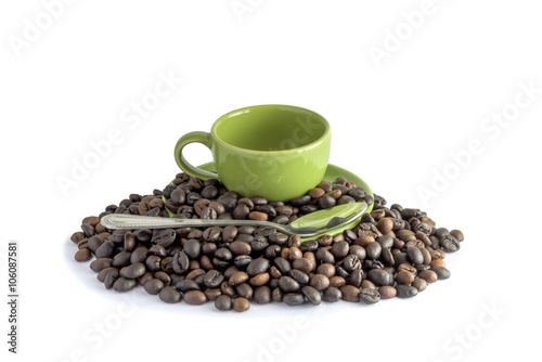 coffee beans and green cup isolated on a white background