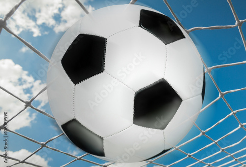 Soccer net the ball and the sky close up