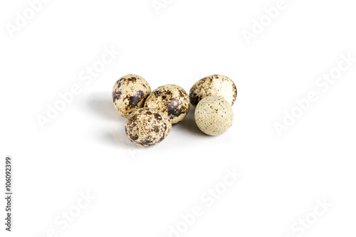 Raw guail eggs isolated on white background photo