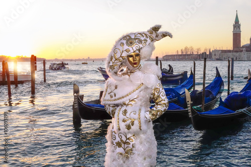 Amazing carnival mask against gondolas in Venice, Italy © Tomas Marek