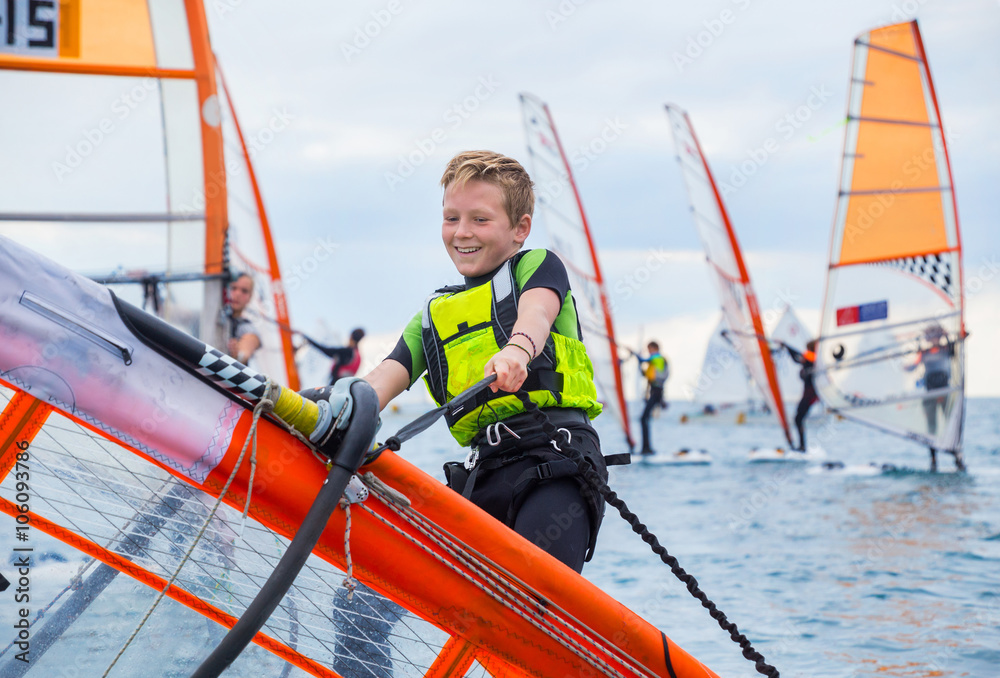 Naklejka premium boy on windsurfing